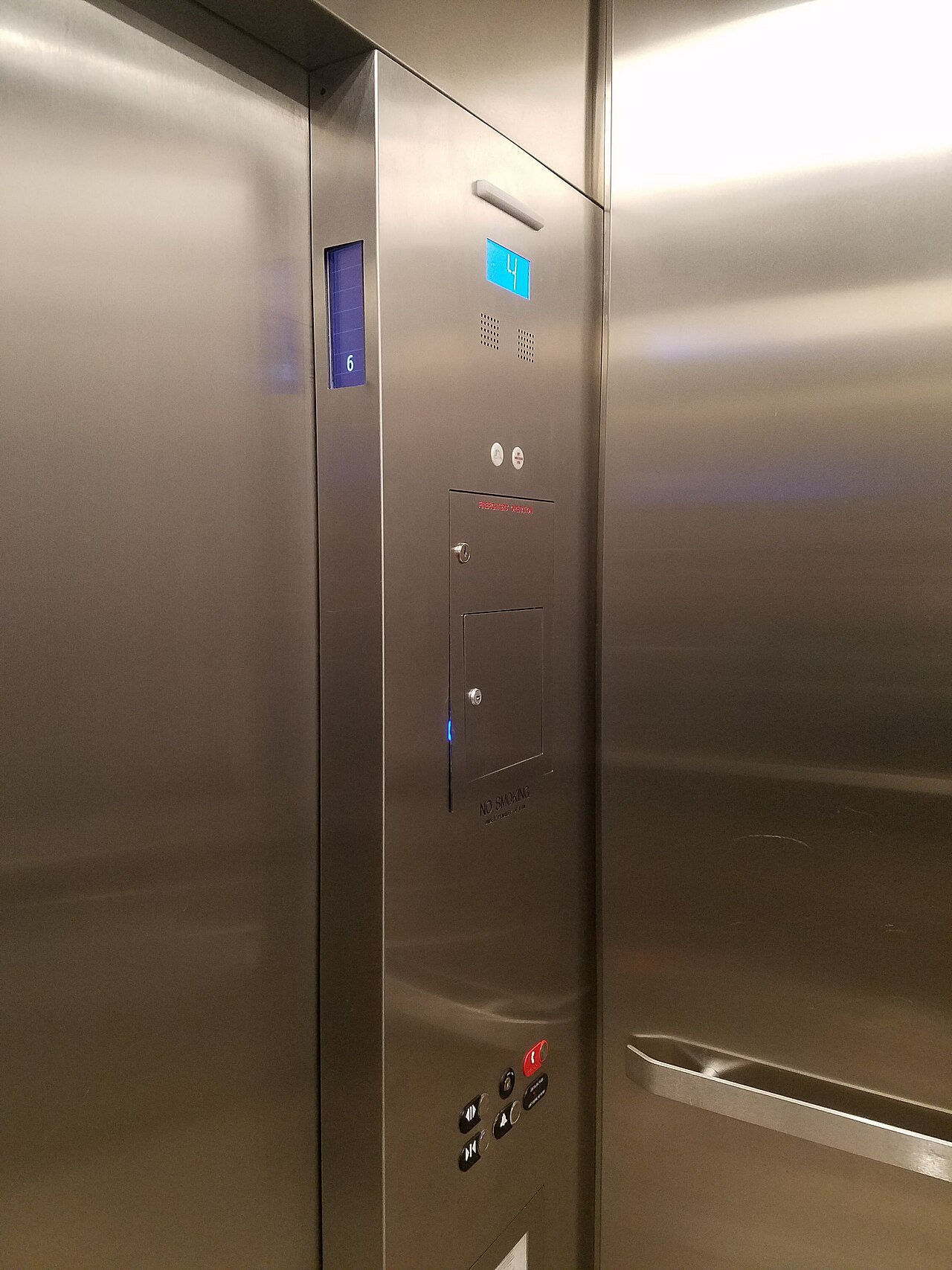 Photographed stainless-steel elevator interior