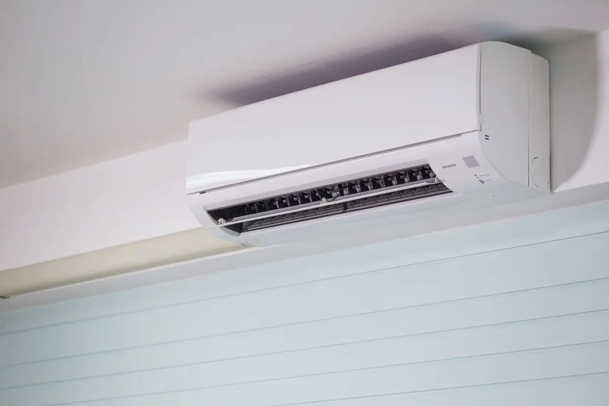 Wall-mounted indoor air-conditioning unit with its outlet louvers visible